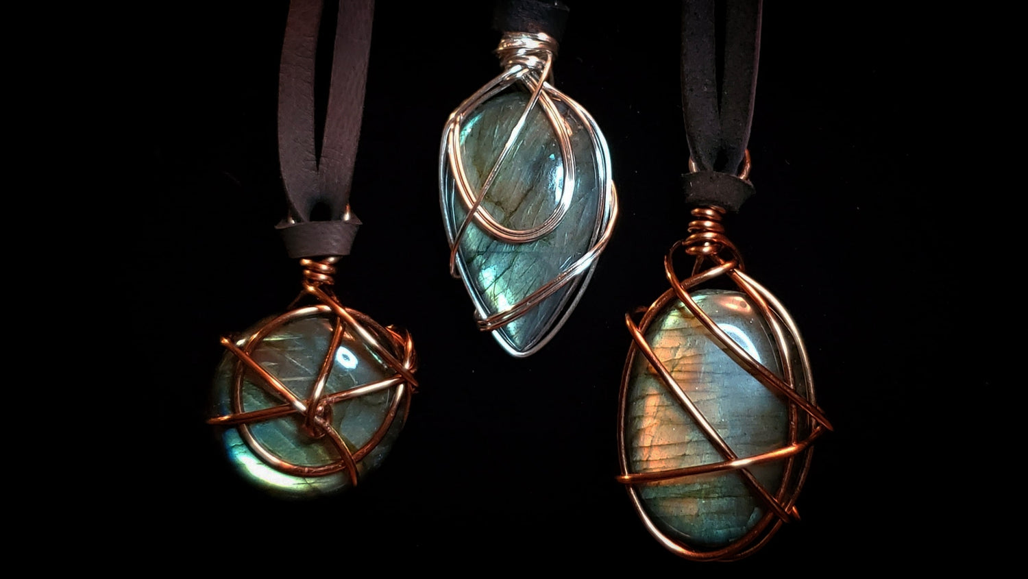 Three copper wire wrapped necklaces featuring labradorite.